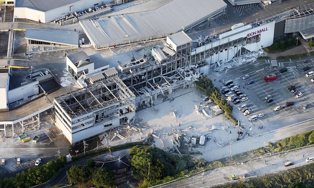 Photo taken from a Kyodo News helicopter on July 28, 2026, shows a partially destroyed Aeon Mall building in Kashima, Kumamoto Prefecture, following reports of an explosion after an earthquake with a preliminary magnitude of 7.1 shook the southwestern Japan prefecture. Multiple people were trapped and injured, media reported. Photo: VCG