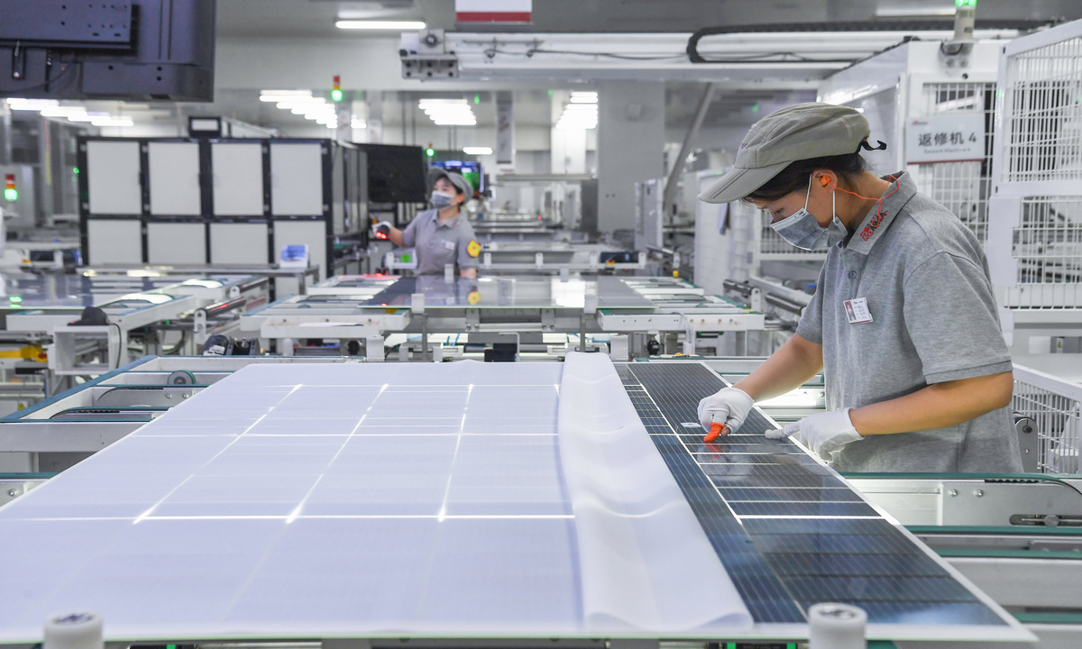 Workers assemble solar photovoltaic modules at a smart manufacturing workshop of Ronma Solar Energy Group in Jindong district of Jinhua city, East China's Zhejiang Province, on July 28, 2026. As the company boosts production capacity and expands overseas sales channels, its products are being exported to Europe, Southeast Asia, the Middle East, and Africa. Photo: VCG