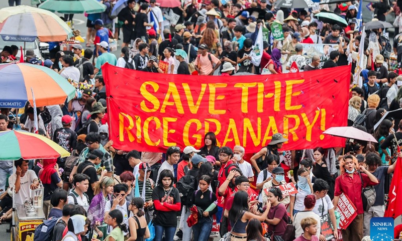 Protesters march with placards during a rally, as President Ferdinand Romualdez Marcos Jr. delivers his 5th State of the Nation Address (SONA) at the House of Representatives, in Quezon City, the Philippines, on July 27, 2026. Various sectors took to the streets to voice their grievances over government policies. (Xinhua/Rouelle Umali)

