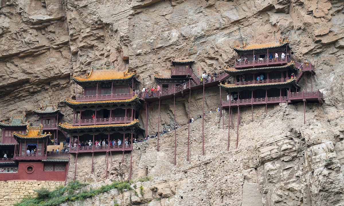 Tourists visit the Hanging Temple in Datong city, North China's Shanxi province on June 29, 2026. Photo: VCG