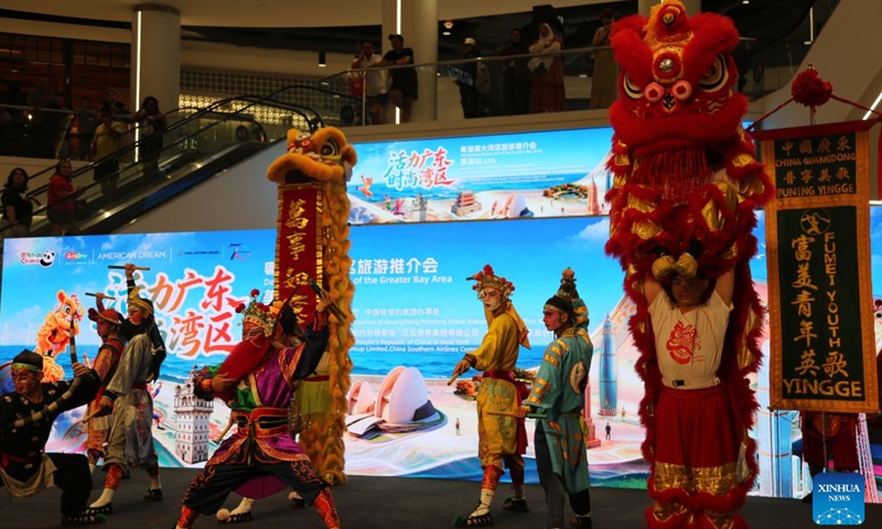 Yingge dance and lion dance are jointly presented at an event to promote tourism for Guangdong-Hong Kong-Macao Greater Bay Area, in East Rutherford, New Jersey, the United States, on July 26, 2026. South China's Guangdong province on Sunday showcased its vast cultural and tourism resources in the United States, inviting American visitors to experience the region's diverse attractions.(Xinhua/Liu Yanan)

