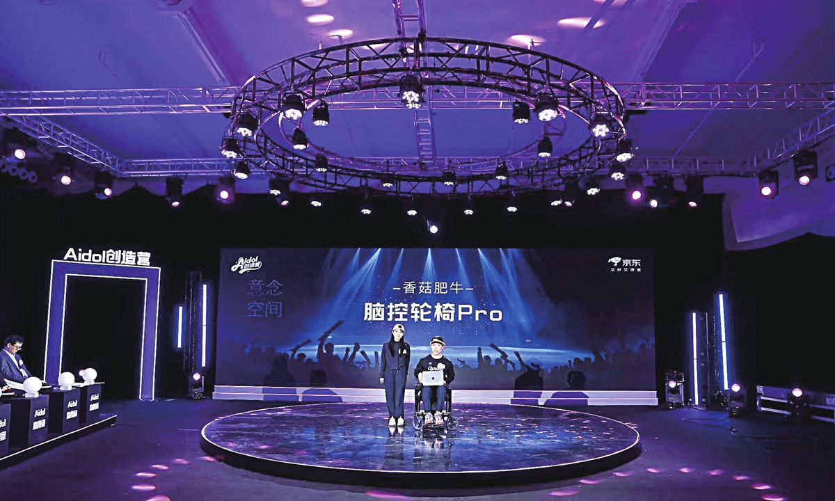 Wang Ning and his wife Xianggu showcase the prototype version of their brain-controlled wheelchair at an AI product competition held on May 26, 2026. Photo: Courtesy of Wang