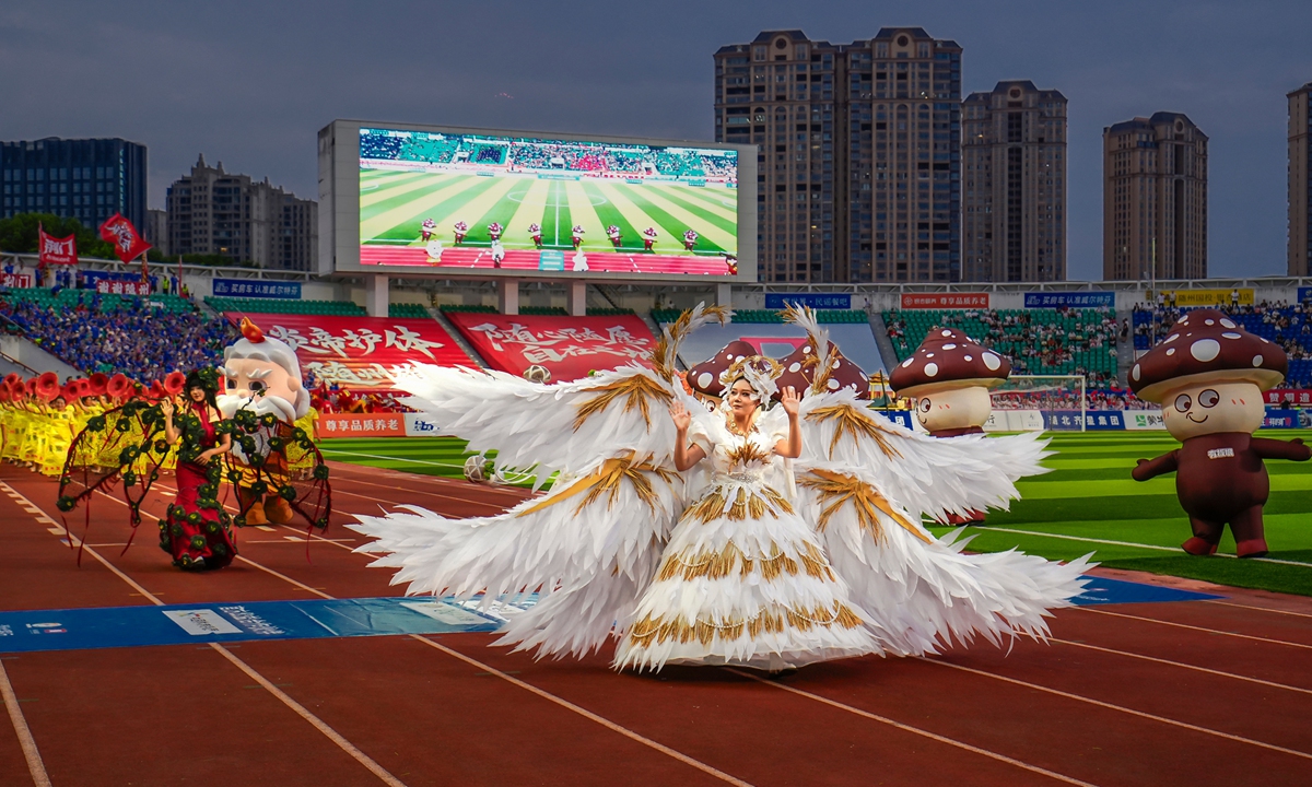Performers wear consumes inspired by vegetables designed by Hu Mengfan at the opening eremony of the 2026 Hubei City Football League. Photos on this page: Courtesy of Hu Mengfan
