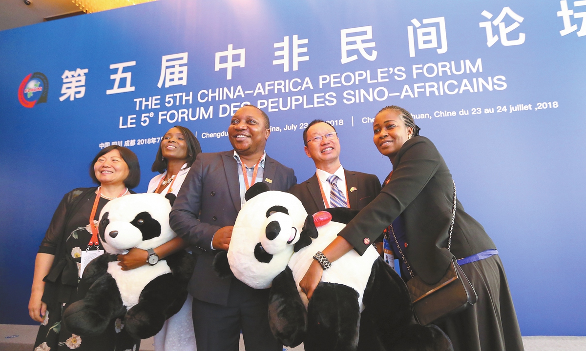 On July 23, 2018, participants of the Fifth China-Africa People's Forum take group photos with panda mascots at the venue in Chengdu, capital of Southwest China's Sichuan Province. Photo: VCG