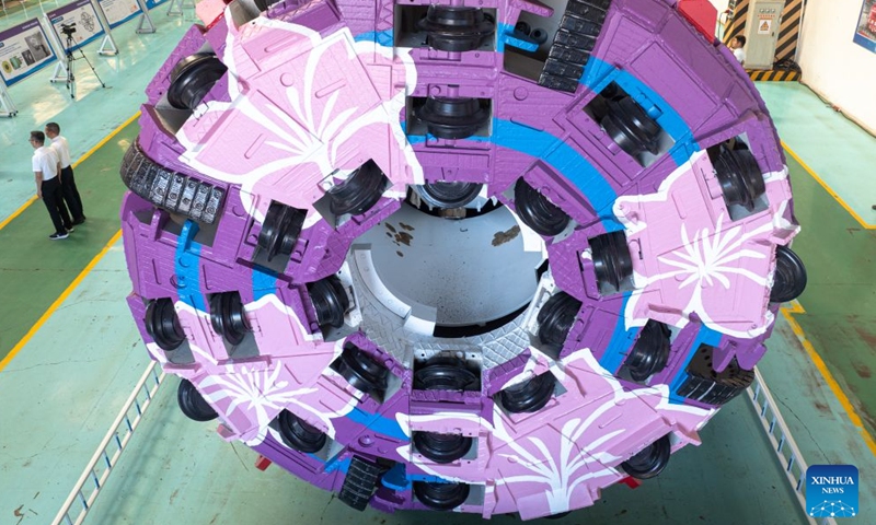 A drone photo taken on Aug. 1, 2026 shows China's first boring and blasting machine at a manufacturing base of China Railway Science & Industry Group in Wuhan, central China's Hubei Province. China's first boring and blasting machine rolled off the production line here on Saturday, filling the gap in integrated tunneling equipment for tunnels with complex geological conditions. (Xinhua/Xiao Yijiu)