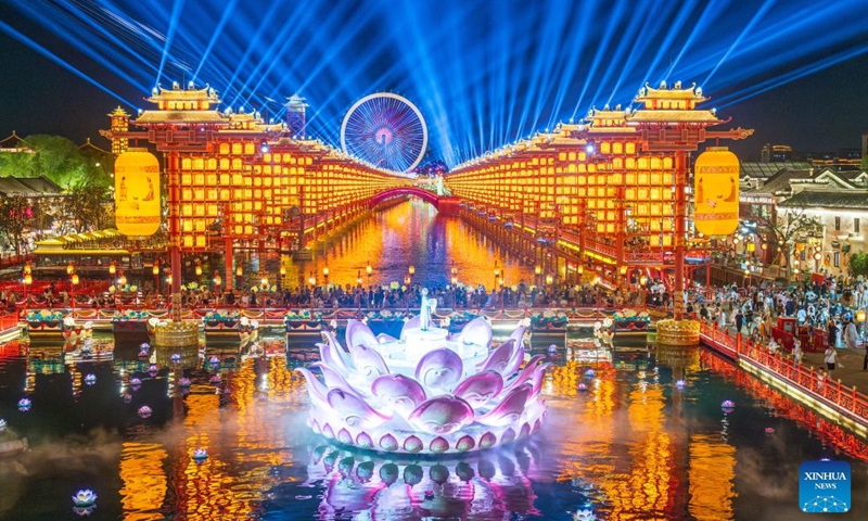 Tourists visit the Hetou Old Street scenic area in Fengnan District of Tangshan City, north China's Hebei Province, July 31, 2026.
Various performances including light shows and molten iron fireworks are staged here this summer, giving a boost to local tourism consumption. (Photo by Li Xiuqing/Xinhua)