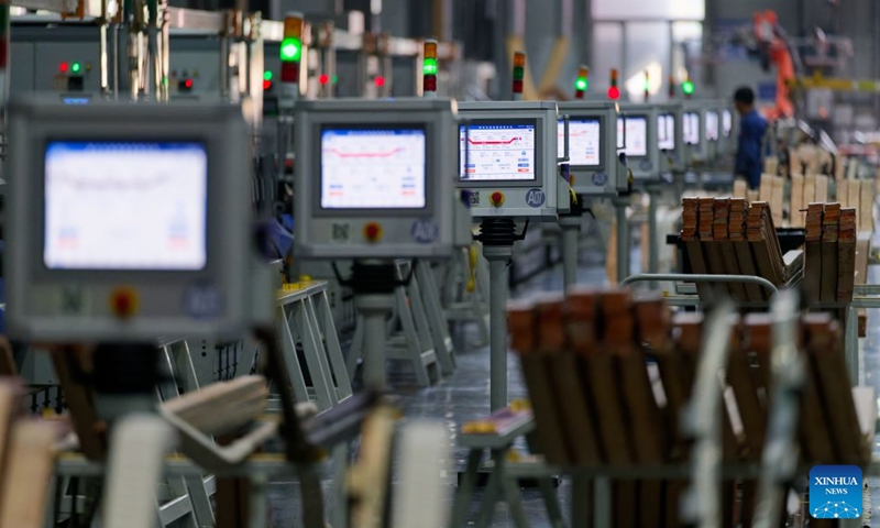 This photo taken on July 28, 2026 shows an intelligent manufacturing equipment working at a workshop of Harbin Electric Machinery Co., Ltd. in Harbin, northeast China's Heilongjiang Province.(Xinhua/Zhang Tao)