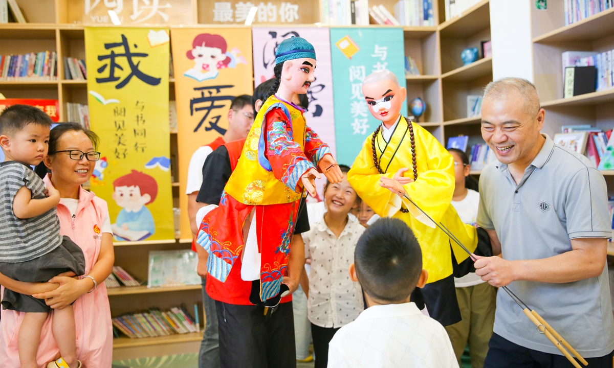 An inheritor of rod puppetry demonstrates traditional puppet manipulation skills in Rugao, East China's Jiangsu Province, on August 2, 2026. Rugao rod puppetry dates back to the Han Dynasty (206BC-AD220) and was listed among Jiangsu Province's first intangible cultural heritage items in 2007. Photo: VCG