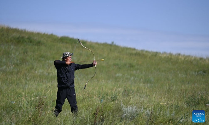 A herdsman takes part in an archery competition during the opening of a starry grassland tourism season in Xilingol League, north China's Inner Mongolia Autonomous Region, Aug. 1, 2026. A starry grassland tourism season kicked off here on Saturday, featuring nine themed events including starry-sky photography exhibitions and regular stargazing experience sessions. (Xinhua/Lian Zhen)