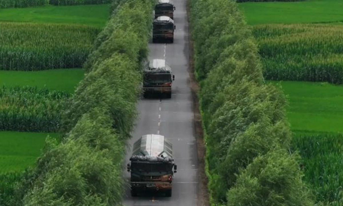 PLA Rocket Force's DF-17 hypersonic missile launch vehicles drive in orderly formation in a line on a rural road. Photo: Screenshot from the China Military Bugle, an official media account affiliated with the PLA news media center