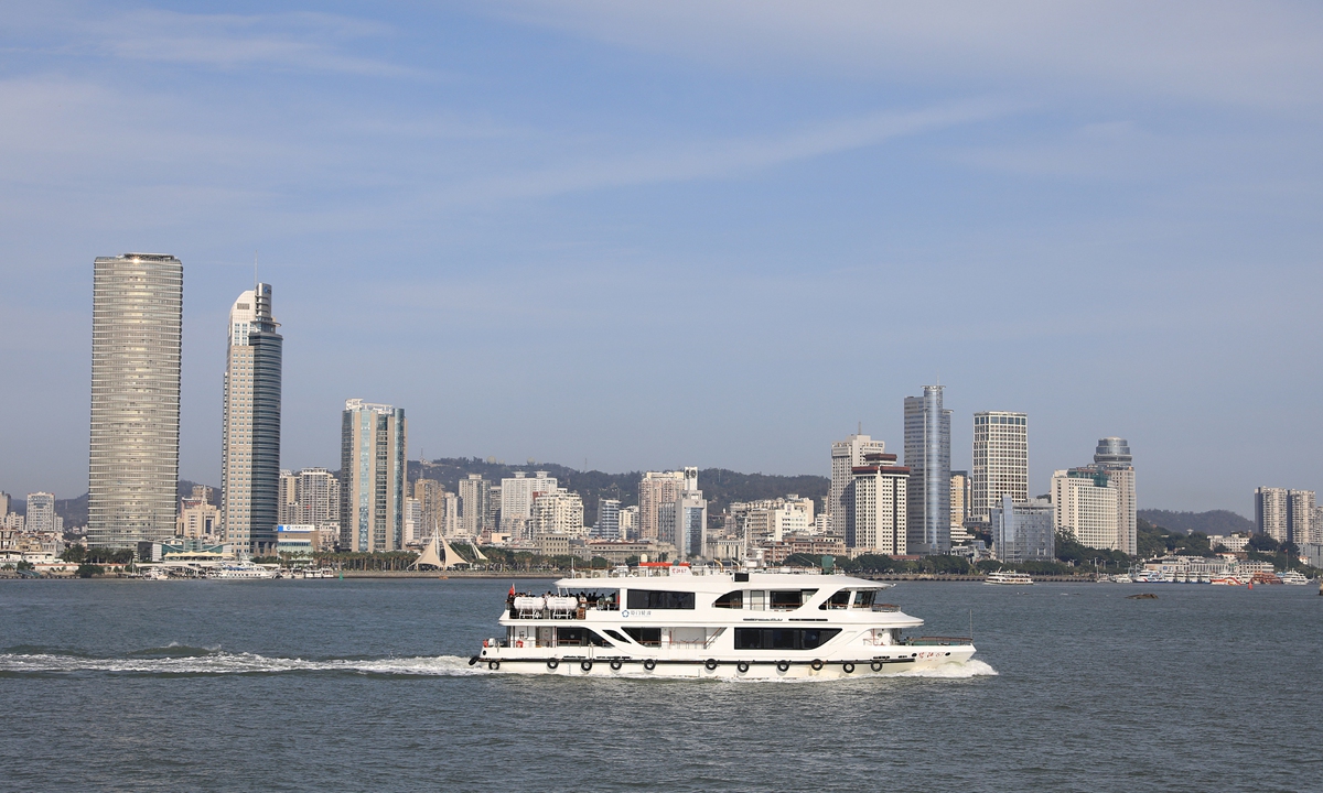 A cruise boat sails against the skyline of Xiamen in East China's Fujian Province. File photo: VCG