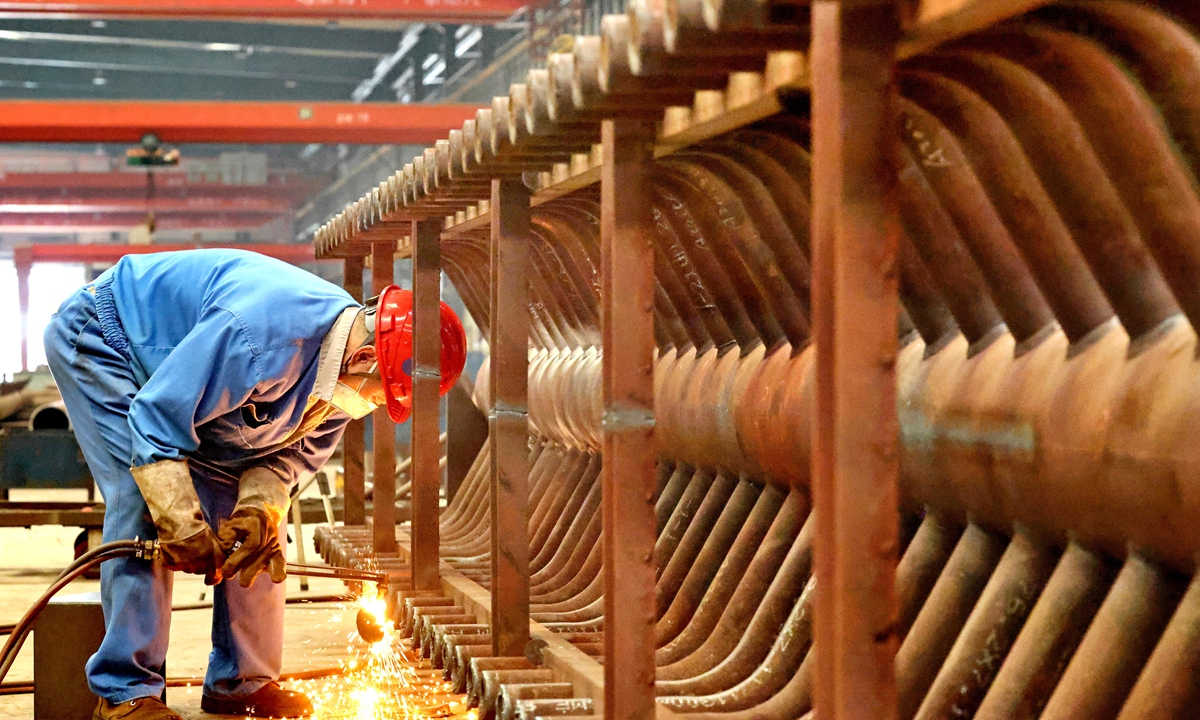 A worker fulfills orders for energy-saving and environmentally friendly boilers destined for export in a manufacturing enterprise in Nantong, East China's Jiangsu Province on August 4, 2026. The enterprise offers products including industrial waste disposal equipment, with sales to more than 30 countries and regions. Photo: CNS Photo