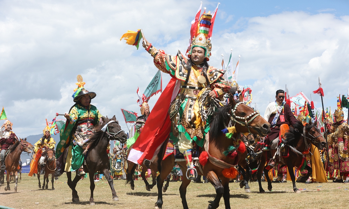 People perform at the opening ceremony of a Gesar-themed Culture and Tourism Festival in Maqin county, the Golog Tibetan Autonomous Prefecture, Northwest China's Qinghai Province on August 4, 2026.