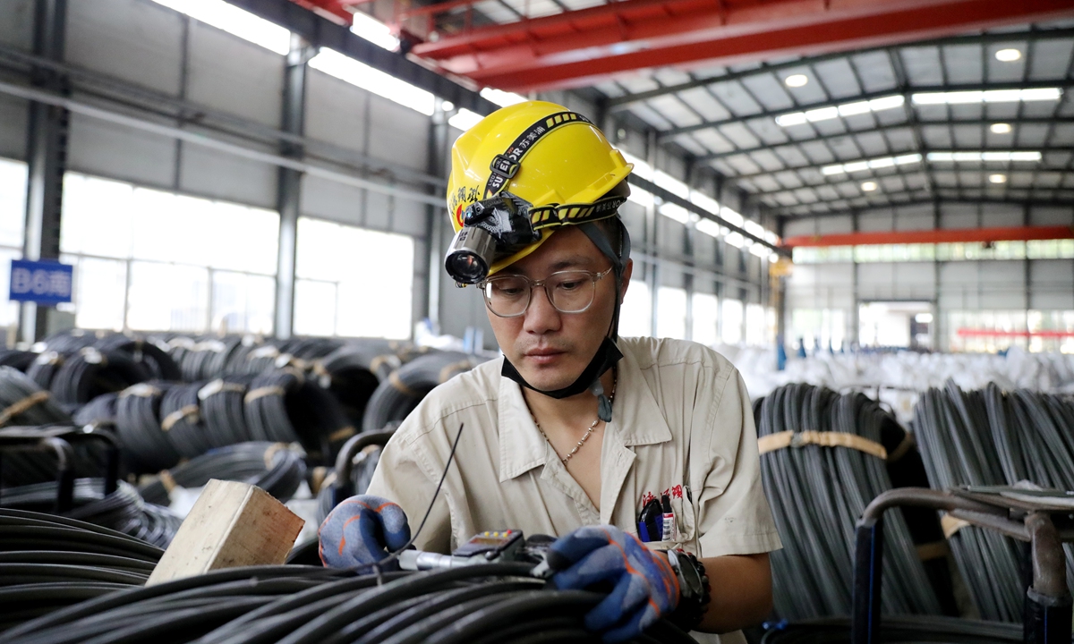 A worker inspects the quality of steel products at a specialty steel company in Jiyuan, Central China's Henan Province, on August 6, 2026. The company runs an advanced globally competitive full-process production line from pickling and heat treatment to wire drawing and packaging. China exported 54.874 million tons of steel products in the first half of 2026, remaining a key global steel exporter.
Photo: VCG