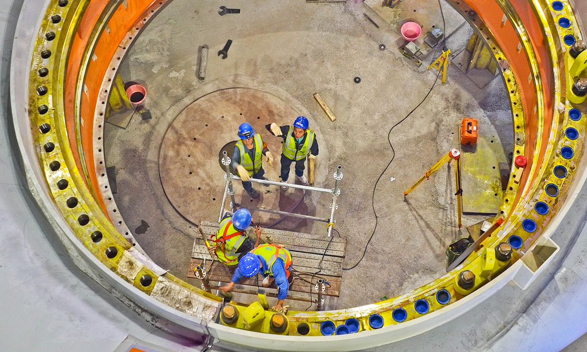 Construction workers carry out the assembly and welding of the stay ring and spiral casing inside a pumped-storage power station in Zhangye, Northwest China's Gansu Province on August 6, 2026. The construction of the power station started in 2022, and all the four 350,000-kW reversible pump-turbine units are expected to be fully put into operation by 2029. Photo: VCG