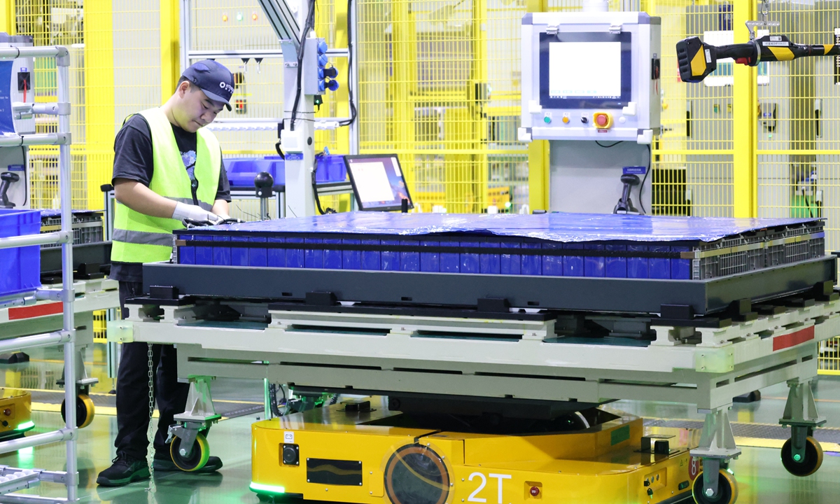 A worker conducts module connections at the long-duration energy storage industrial park in Heze, East China's Shandong Province, on August 7, 2026. The world's first integrated industrial park dedicated to long-duration energy storage has begun mass production of 1,175Ah cells and 6.25MWh energy storage systems. Photo: VCG