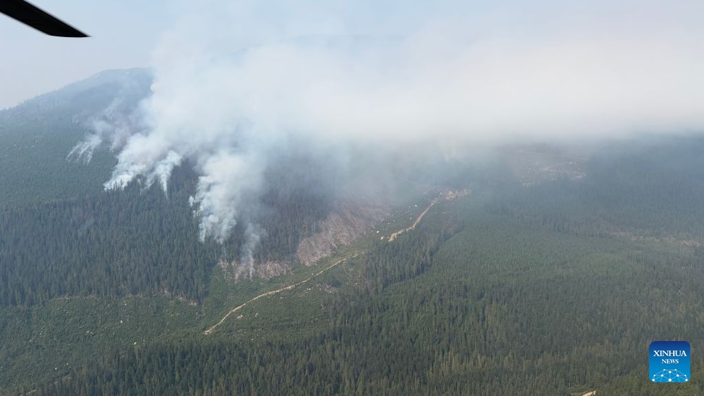 An aerial drone photo provided by the BC Wildfire Service on Aug. 6, 2026 shows a wildfire near Kamloops in south-central British Columbia, Canada. The western Canadian province of British Columbia (B.C.) declared a provincial state of emergency on Saturday as fast-spreading wildfires threatened several communities. (BC Wildfire Service/Handout via Xinhua)