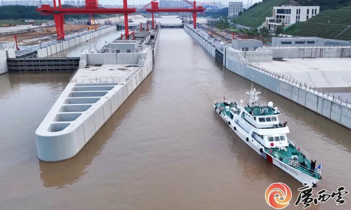 Haixun 1003 sails out of the Qingnian ship lock along the Pinglu Canal on August 7, 2026. Photo: Guangxi Daily