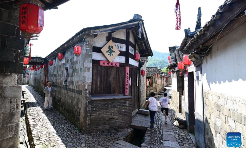 Tourists are pictured at Peitian Village in Xuanhe Town, Liancheng County, Longyan City, southeast China's Fujian Province, Aug. 5, 2026.