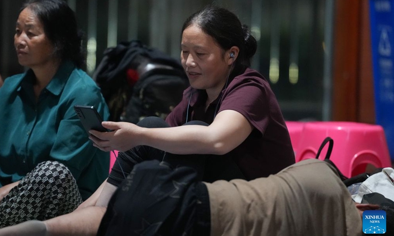 Residents are pictured at a temporary shelter in a middle school in Yuhuan, Taizhou City, east China's Zhejiang Province, Aug. 8, 2026.