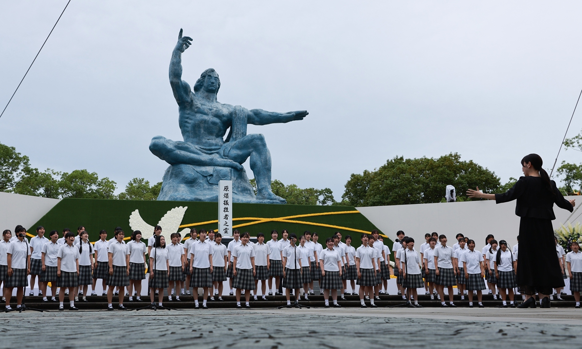 High school students sing a song composed for the 50th anniversary of the A-bombing in 1995, Senbazuru (A Thousand Paper Cranes) during a Nagasaki Peace Ceremony to commemorate the 81st anniversary of the atomic bombing at the Peace Park in Nagasaki on August 9, 2026. Photo: VCG