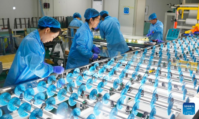 Workers are seen at a glass factory in Qinhuangdao, north China's Hebei Province, Aug. 8, 2026. The city is driving the transformation and upgrading in its glass manufacturing sector, with emphasis on products for artistic creation and other special purposes. (Photo by Yan Zhiguo/Xinhua)