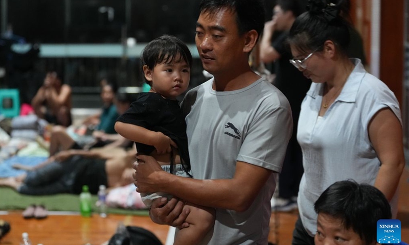 Residents are pictured at a temporary shelter in a middle school in Yuhuan, Taizhou City, east China's Zhejiang Province, Aug. 8, 2026.
