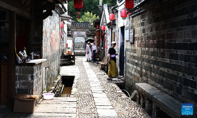 Tourists visit Peitian Village in Xuanhe Town, Liancheng County, Longyan City, southeast China's Fujian Province, Aug. 5, 2026.