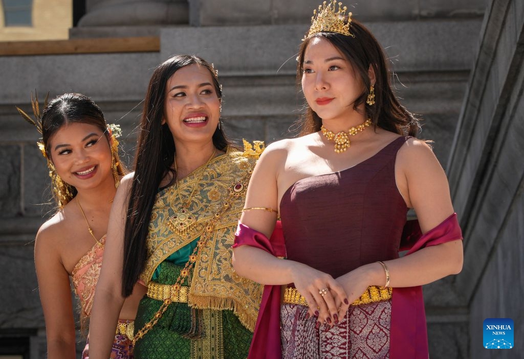 Models present traditional Thai costumes during the 2026 Thai Festival in Vancouver, British Columbia, Canada, Aug. 8, 2026. The annual Thai Festival featured traditional food, music, dance, crafts and cultural performances, highlighting Thailand's rich and vibrant culture. (Photo by Liang Sen/Xinhua)