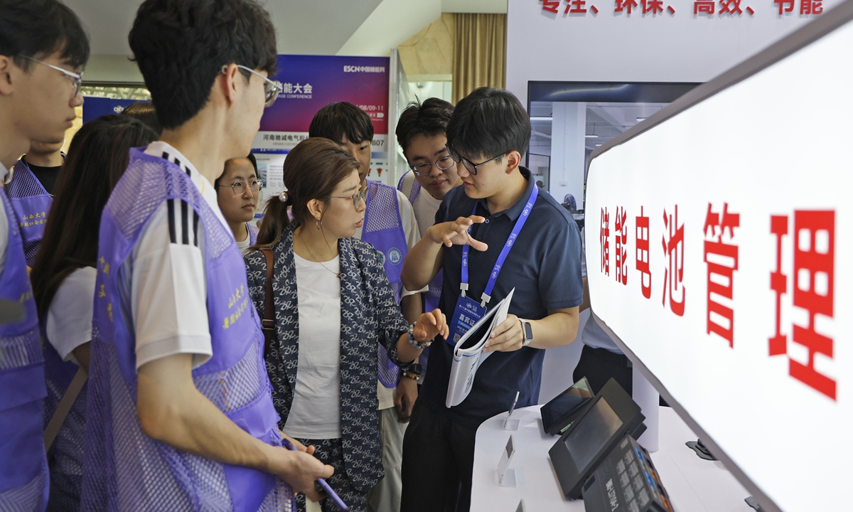 A staff member shows energy storage battery management products to visitors at the 16th China International Energy Storage Conference and Exhibition in Hangzhou, East China's Zhejiang Province, on August 10, 2026. The event brought together more than 130 companies to showcase the latest technologies, products, and solutions across the energy storage industry chain in support of the green energy transition. Photo: VCG