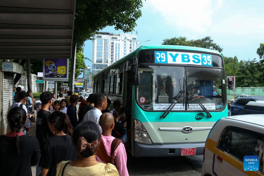 People get on a Yangon Bus Service (YBS) bus in Yangon, Myanmar, Aug. 15, 2026. Public bus fares on the Yangon Bus Service (YBS) routes, the main public bus network in Yangon, will increase from Sept. 1 to address rising costs of vehicle spare parts and maintenance, the state-owned daily The Global New Light of Myanmar reported Saturday. (Photo: Xinhua)