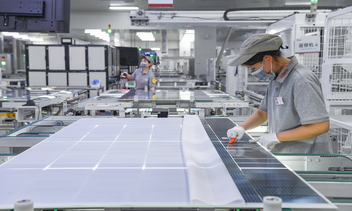 Workers assemble solar photovoltaic modules at a smart manufacturing workshop of Ronma Solar Energy Group in Jindong district of Jinhua city, East China's Zhejiang Province, on July 28, 2026. Photo: VCG