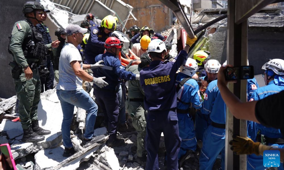 Rescuers work at a collapsed building after an earthquake in the city of Manizales, Colombia, Aug. 10, 2026. The death toll from a magnitude 7.4 earthquake that struck western Colombia on Monday has risen to 111 nationwide, with 87 others injured, Colombian President Abelardo de la Espriella said in Bogota. (COLPRENSA/Handout via Xinhua)