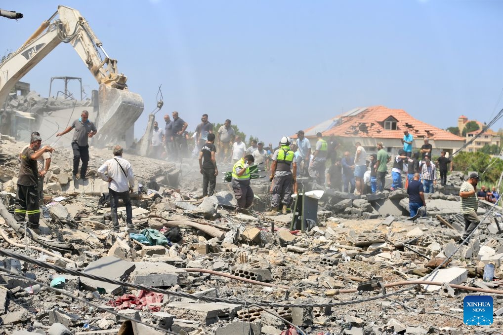 Rescuers search through the rubble of buildings hit by Israeli airstrikes in Deir Al Zahrani, southern Lebanon, Aug. 15, 2026. Lebanese broadcaster Al-Jadeed TV reported that four people were killed and nine others wounded after an Israeli airstrike hit a two-story building in the town of Deir Al Zahrani in the Nabatieh District. (Photo: Xinhua)