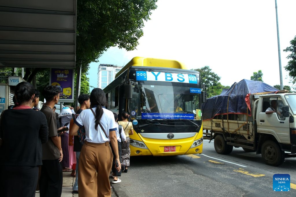 People get on a Yangon Bus Service (YBS) bus in Yangon, Myanmar, Aug. 15, 2026. Public bus fares on the Yangon Bus Service (YBS) routes, the main public bus network in Yangon, will increase from Sept. 1 to address rising costs of vehicle spare parts and maintenance, the state-owned daily The Global New Light of Myanmar reported Saturday. (Photo: Xinhua)