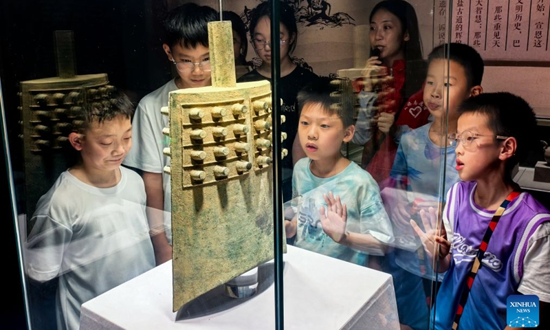 Students visit the Xuan'en County Museum in Xuan'en, central China's Hubei Province, Aug. 15, 2026. Museums in Hubei Province have seen a surging number of children and teenagers on study tours during the summer vacation. With guided tours, hands-on experiences, and intangible cultural heritage classes, these museums are offering more than just exhibitions to enrich the summer life of children and students. (Photo: Xinhua)