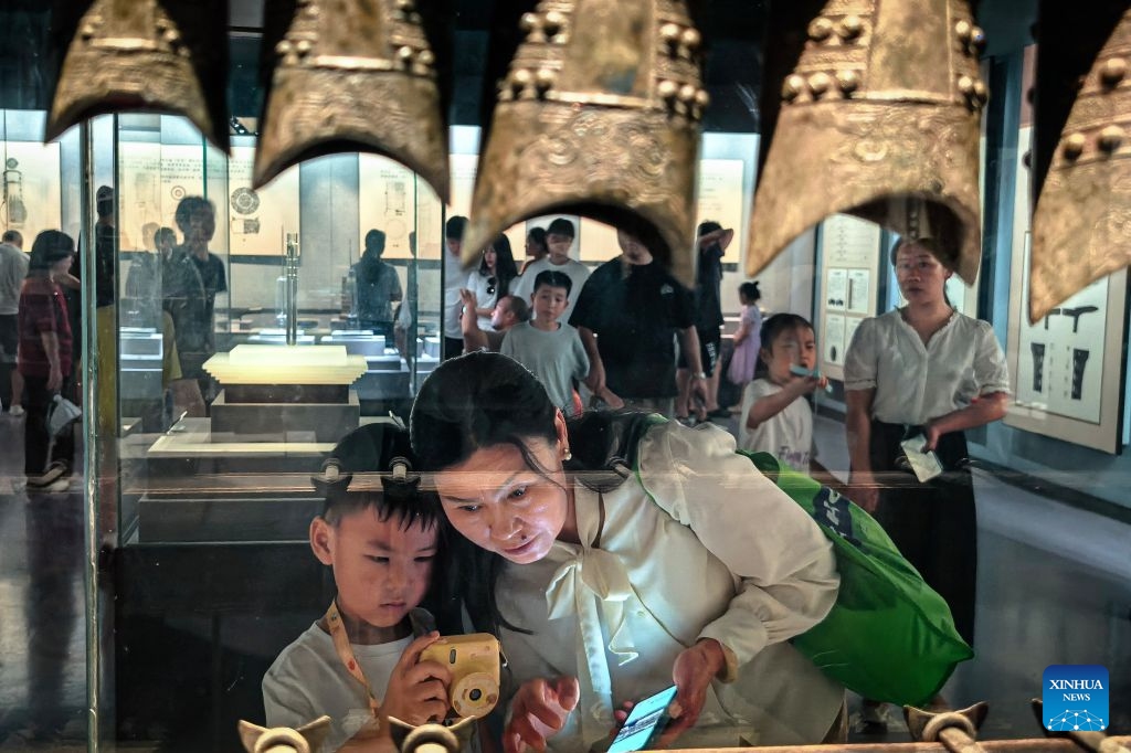 People visit the Jingzhou Museum in Jingzhou City, central China's Hubei Province, Aug. 15, 2026. Museums in Hubei Province have seen a surging number of children and teenagers on study tours during the summer vacation. With guided tours, hands-on experiences, and intangible cultural heritage classes, these museums are offering more than just exhibitions to enrich the summer life of children and students. (Photo: Xinhua)