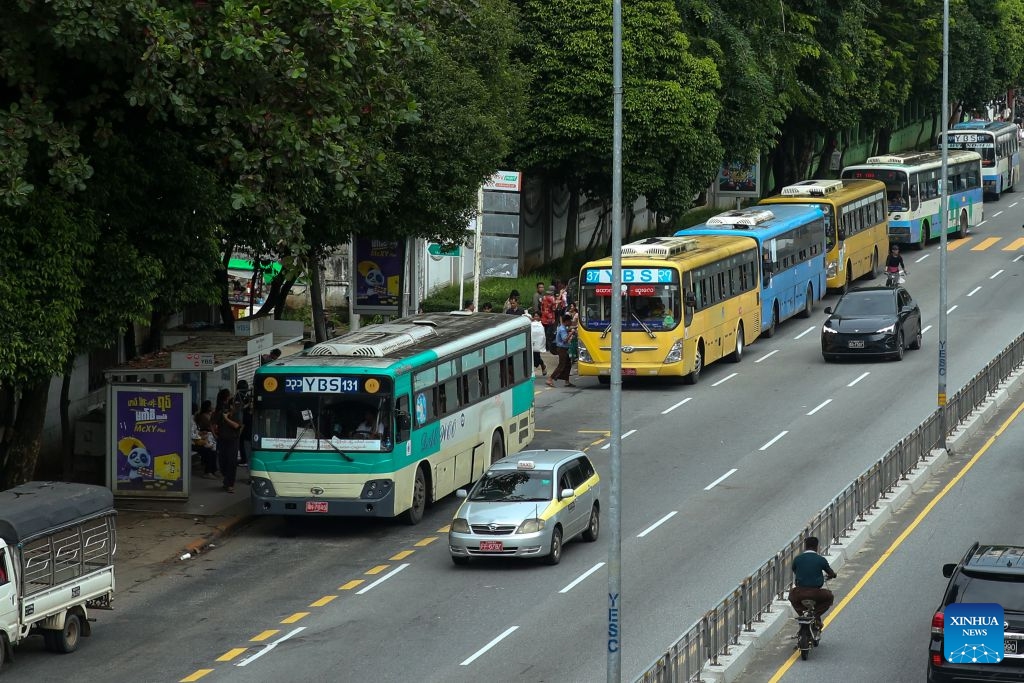 Yangon Bus Service (YBS) buses pull into a bus station in Yangon, Myanmar, Aug. 15, 2026. Public bus fares on the Yangon Bus Service (YBS) routes, the main public bus network in Yangon, will increase from Sept. 1 to address rising costs of vehicle spare parts and maintenance, the state-owned daily The Global New Light of Myanmar reported Saturday. (Photo: Xinhua)