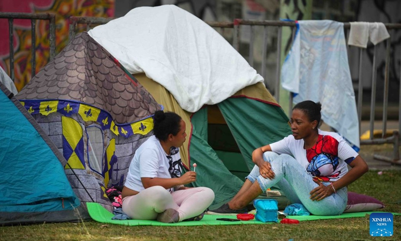 People talk at a temporary settlement at a park after an earthquake in Pereira, Colombia on Aug. 14, 2026. A 7.4-magnitude earthquake jolted western Colombia on Monday. (Photo: Xinhua)