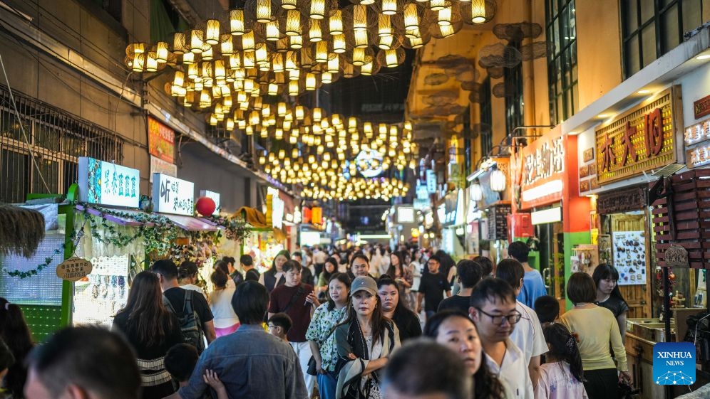 Visitors are seen at a market in Nanming District of Guiyang, southwest China's Guizhou Province, Aug. 14, 2026. The cool climate and rich tourism resources in Guizhou have attracted lots of visitors seeking a summer retreat. (Photo: Xinhua)