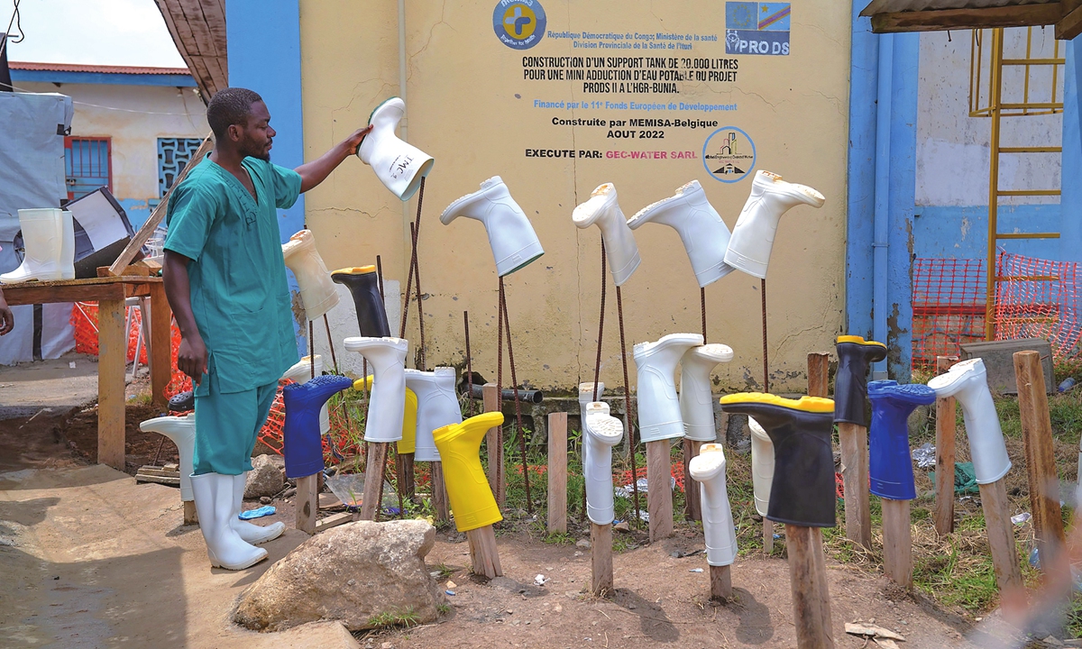 A health worker dries boots that were washed to prevent the spread of the Ebola virus at the treatment centre in Bunia General Hospital in Ituri, eastern Congo, on August 11, 2026. The current outbreak is the 17th Ebola outbreak in the DRC. It is now the country's largest on record and the second-largest Ebola outbreak globally. Photo: VCG