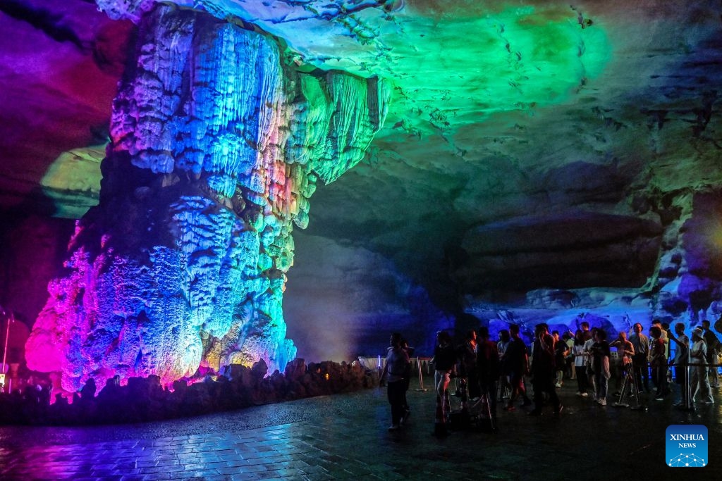Tourists visit a cave in Guilin, south China's Guangxi Zhuang Autonomous Region, Aug. 12, 2026. In recent years, Guangxi has tapped the tourism potential of its caves, developing them into popular attractions while ensuring visitor safety. (Photo: Xinhua)