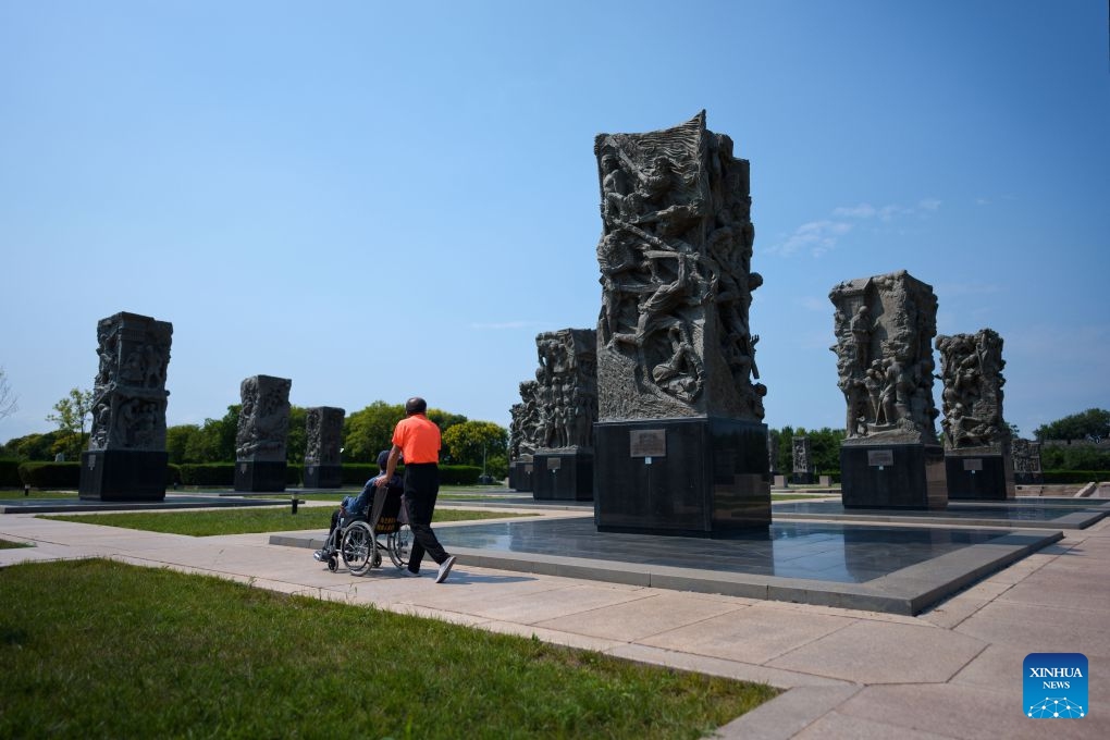 People view sculptures themed on the War of the Chinese People's Resistance Against Japanese Aggression adjacent to Wanping Town in Beijing, capital of China, Aug. 15, 2026. People came to the Lugou Bridge cultural tourism area on Saturday on the occasion of the 81st anniversary of Japan's announcement of its unconditional surrender in World War II to commemorate the history. (Photo: Xinhua)