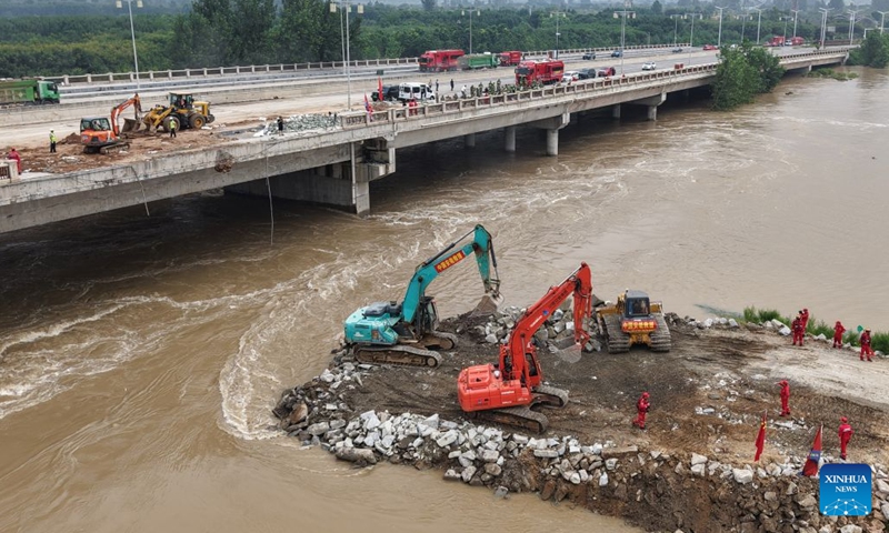 A drone photo take on Aug. 15, 2026 shows repair work underway at the site of a levee breach along the Jialu River in Chuanhui District of Zhoukou City, central China's Henan Province. Around 11 p.m. on Thursday, a breach occurred on the east bank embankment of the Jialu River below a bridge in Chuanhui District of Zhoukou City, due to pressure of upstream inflow from the Jialu River and backflow from the Shaying River,. (Photo: Xinhua)