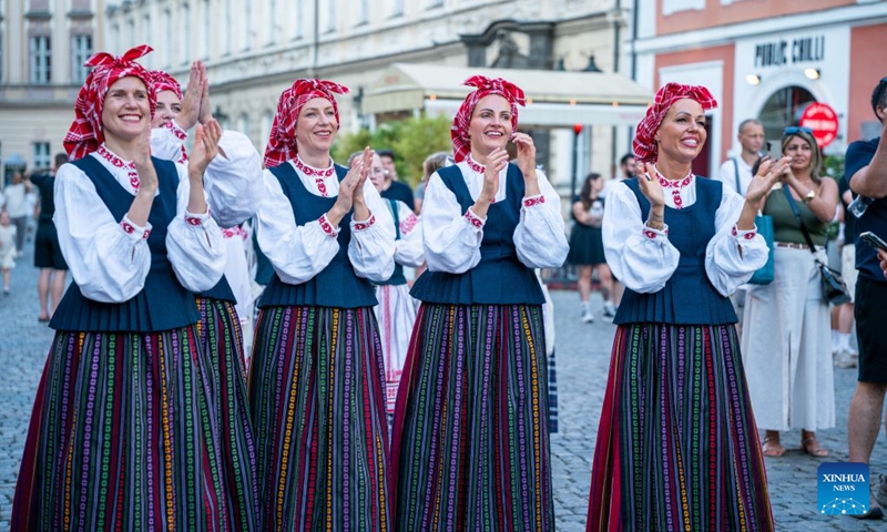 People attend the Summer Folklore Festival in Prague, the Czech Republic, Aug. 15, 2026. The Summer Folklore Festival was held in Prague on Saturday, bringing together international folklore ensembles presenting their traditional dances, music and costumes. (Photo: Xinhua)
