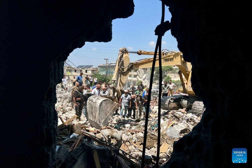 Rescuers search through the rubble of buildings hit by Israeli airstrikes in Deir Al Zahrani, southern Lebanon, Aug. 15, 2026. Lebanese broadcaster Al-Jadeed TV reported that four people were killed and nine others wounded after an Israeli airstrike hit a two-story building in the town of Deir Al Zahrani in the Nabatieh District. (Photo: Xinhua)