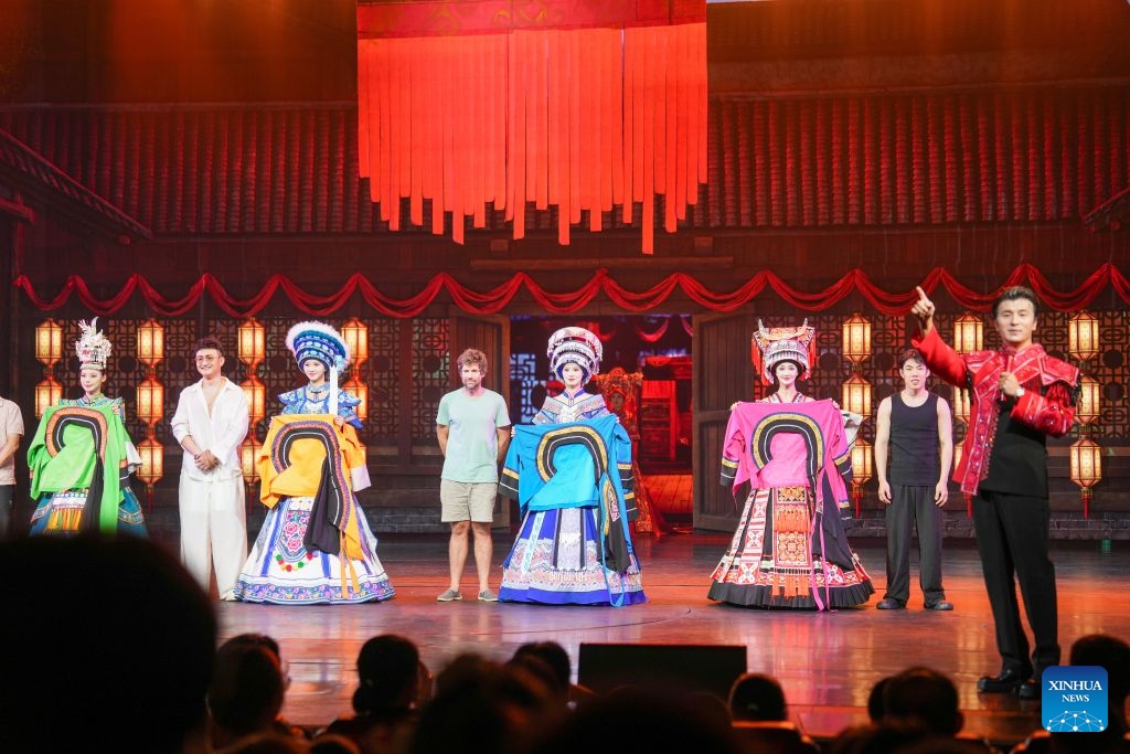 The Charming Xiangxi show is staged in Zhangjiajie, central China's Hunan Province, Aug. 14, 2026. Leveraging its rich intangible cultural heritage, the city of Zhangjiajie has developed diverse summer getaways and multiple forms of night tours, fueling a travel boom during the peak season. (Photo: Xinhua)