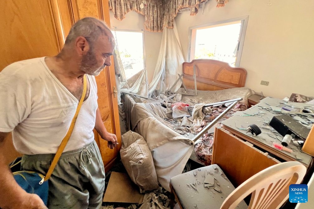 A man inspects his house after an Israeli strike on a nearby building in Deir Al Zahrani, southern Lebanon, Aug. 15, 2026. Lebanese broadcaster Al-Jadeed TV reported that four people were killed and nine others wounded after an Israeli airstrike hit a two-story building in the town of Deir Al Zahrani in the Nabatieh District. (Photo: Xinhua)