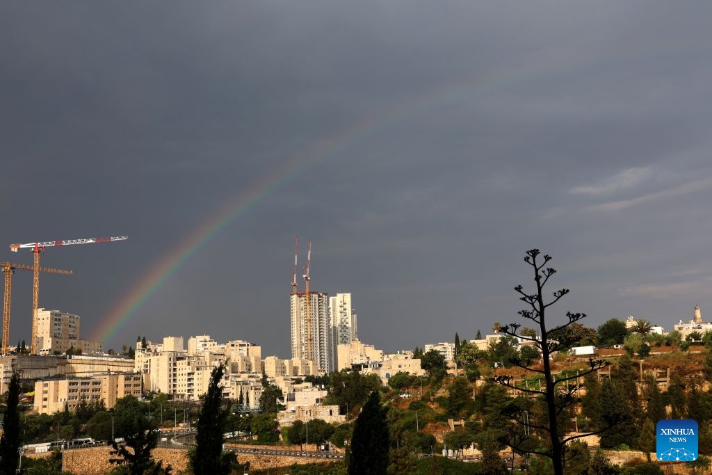 A rainbow appears over Jerusalem after heavy downpours, Aug. 15, 2026. Rare heavy downpours trigger mountain flash floods and urban waterlogging across Jerusalem on Saturday. The region is currently in midsummer, a period typically marked by extreme drought and almost zero precipitation. (Photo: Xinhua)