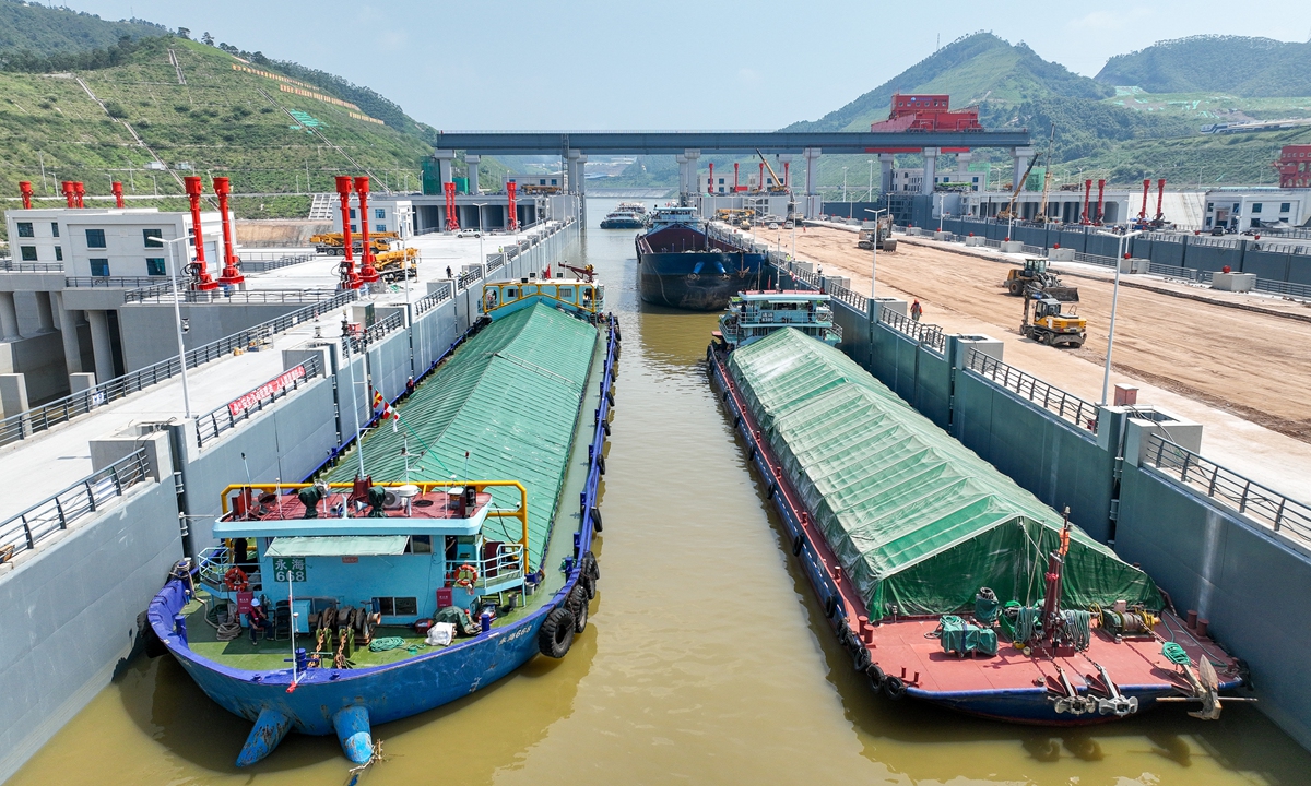 Vessels enter a ship lock of the Pinglu Canal in Lingshan county, Qinzhou, South China's Guangxi Zhuang Autonomous Region on August 12, 2026.